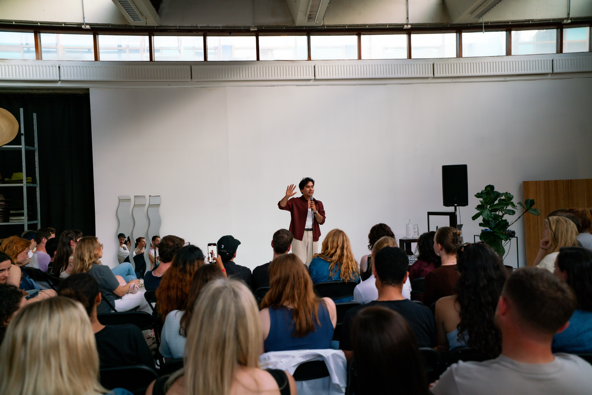 Alp on stage facilitating a storytelling session
